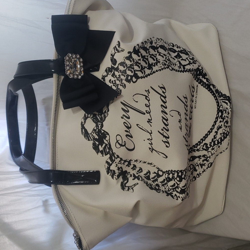 Brighton My Flat In London purse.  White and black.